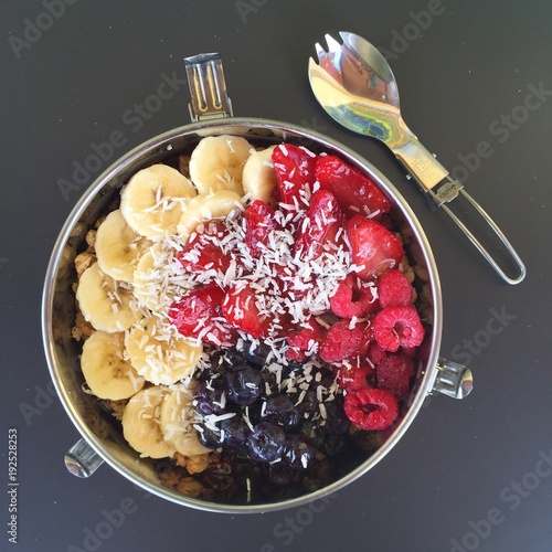 Acai breakfast bowl with fruit in metal tiffin photo