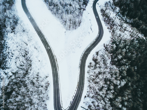 mountain road on a winter snowy day top down view © Mihail