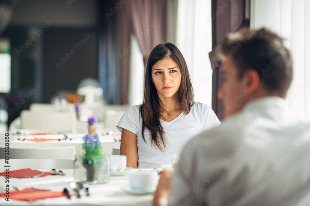 Empathetic emotional woman listening about bad news,problems.Sad woman feeling absent and not interested.Doubting fidelity.Evaluating judging person.Boring date.Having a negative feeling,thought.