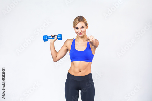 Hey you! Go fitness now! Blonde sporty woman pointing at camera