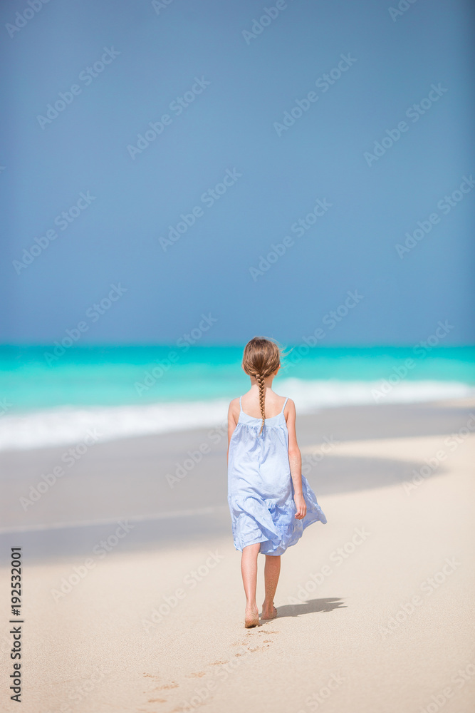 Adorable little kid at beach during summer vacation