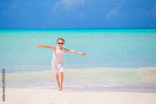 Adorable little kid at beach during summer vacation