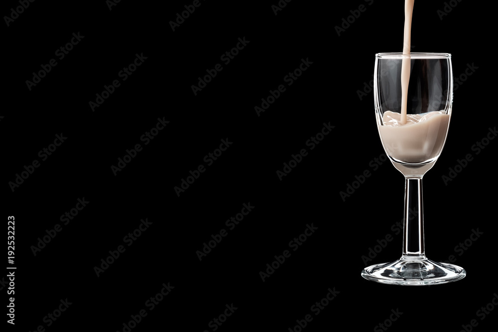 A shot glass filled with liquor. A shot glass filled with liquor.