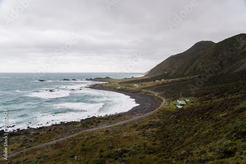 Landscape view of a road next to the ocean in New Zealand. 