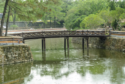 bridge in the pond inside the complex of the mausoleum of the emperor Tu Duc in Hue, Vietnam.