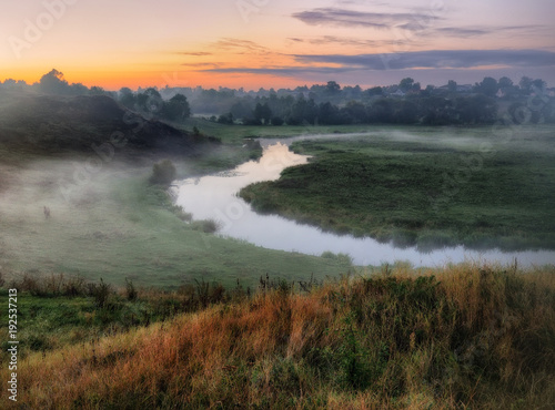 autumn morning. dawn by the river. picturesque fog