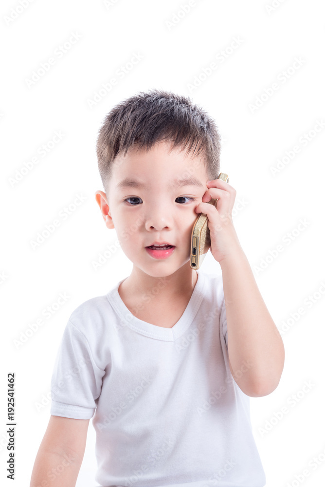 Little asian boy wearing white t-shirt and talking via mobile phone over white background Little asian boy wearing white t-shirt and talking via mobile phone over white background