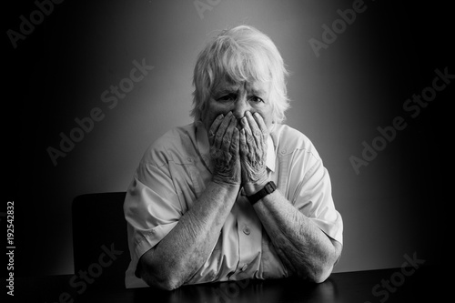 Elderly woman distressed, upset and sad
