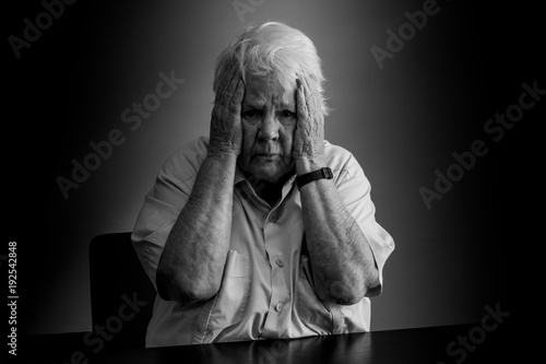 Elderly woman distressed, upset and sad