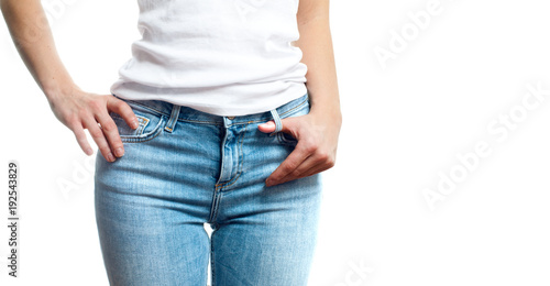Slim woman in jeans and white t-shirts