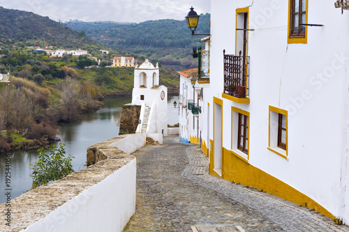 Typical narrow street in the ancient town of Mertola, Alentejo Region, Portugal
