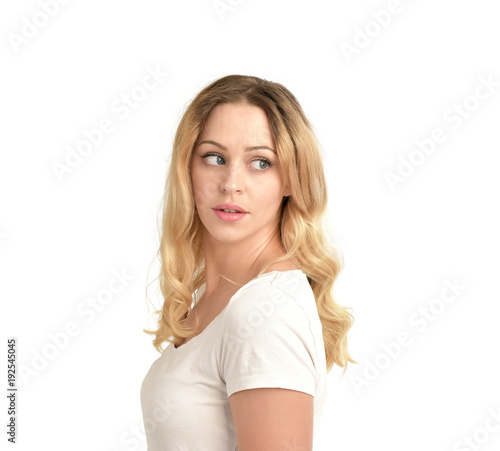 3/4 portrait of blonde girl wearing white shirt, isolated on white background.