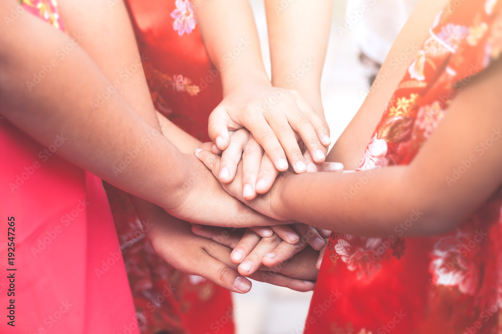 Children holding hands and playing together with unity and teamwork Children holding hands and playing together with unity and teamwork
