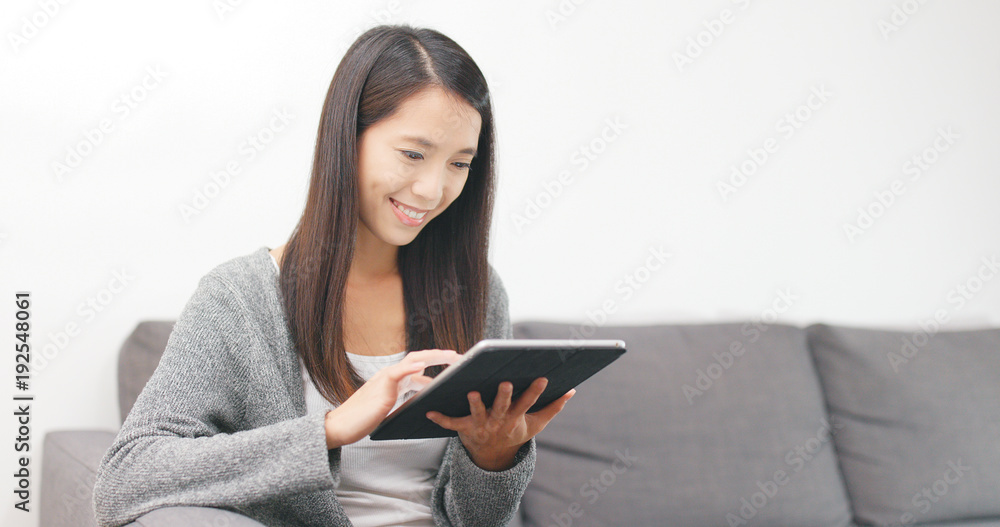 Woman use of tablet computer at home Woman use of tablet computer at home