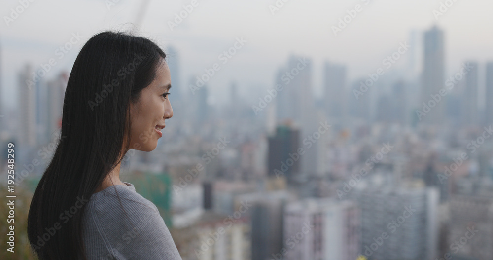 Woman looking at the city view
