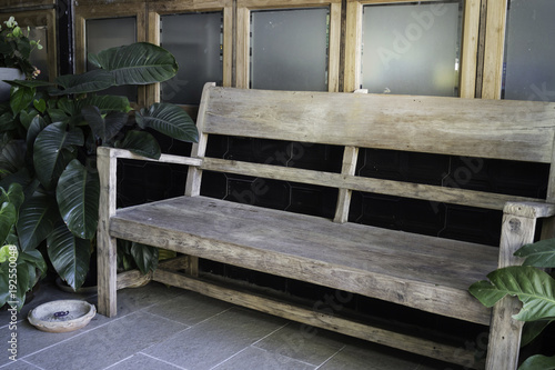 Wooden bench in home garden