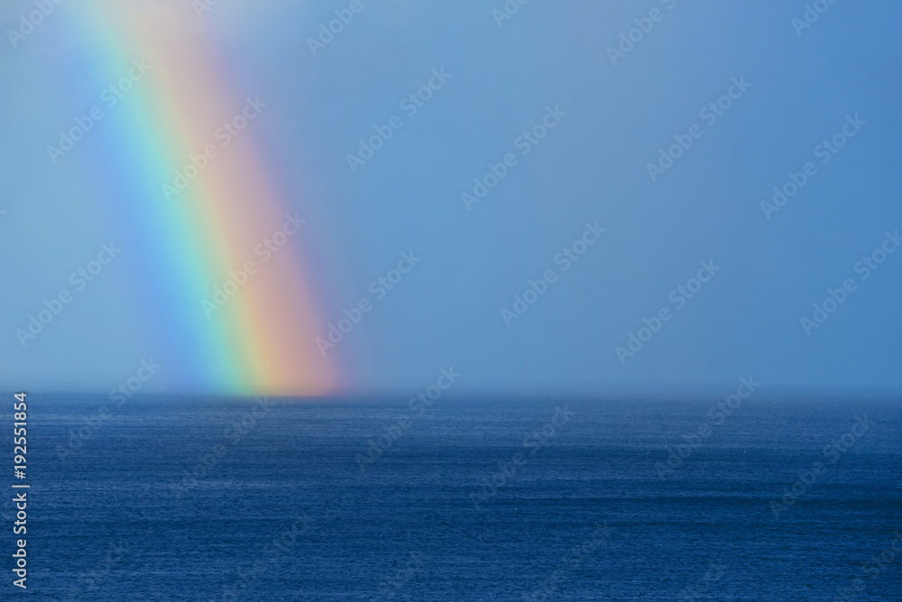 Beautiful rainbow on the ocean horizon