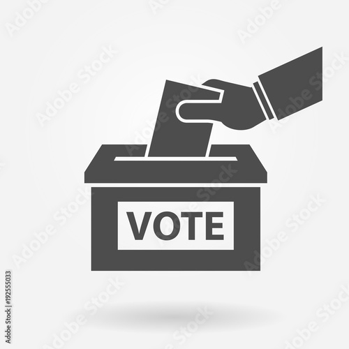 Voting concept. Hand putting paper in the ballot box 