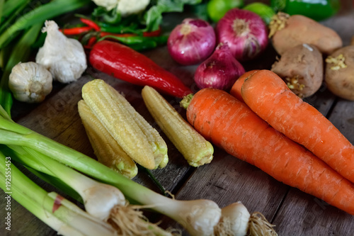 Too many vegetables on wooden background