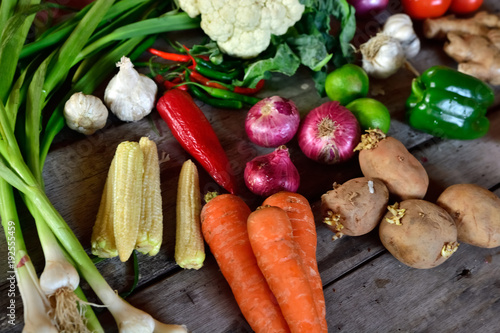 Too many vegetables on wooden background