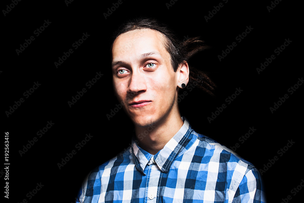 Fototapeta premium Portrait of young cool man with dreadlocks