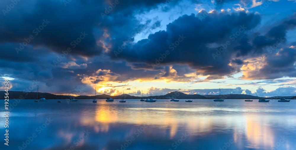Sunrise Waterscape with Clouds and Boats