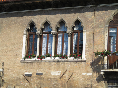 Vintage window and detail of a classical building in the historical center of Venezia.