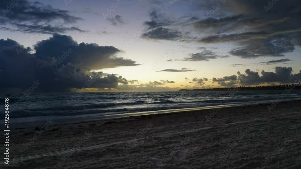 Dramatic sunset over ocean waves. Clouds Dramatic sunset over ocean waves. Clouds
