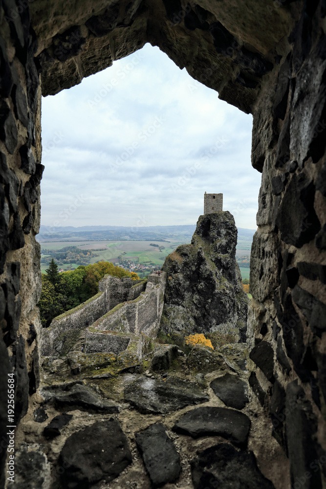 Castle tower on the steep rock over the window frame
