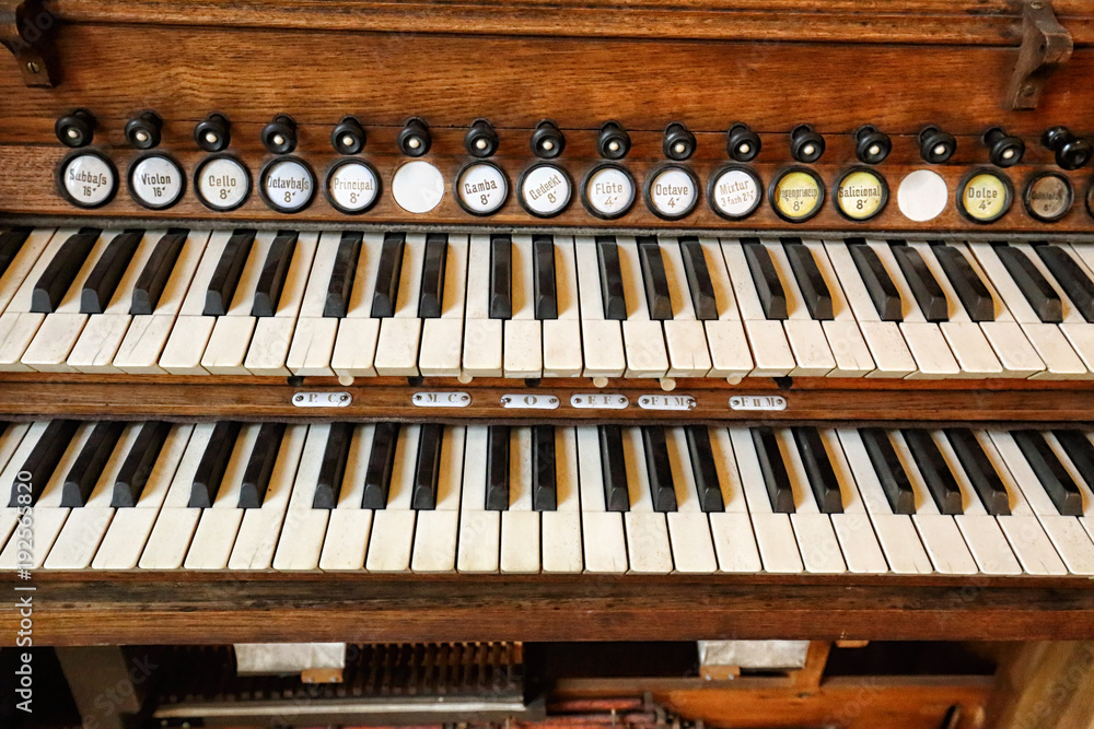 Old double piano keyboard with marked keys Photos | Adobe Stock