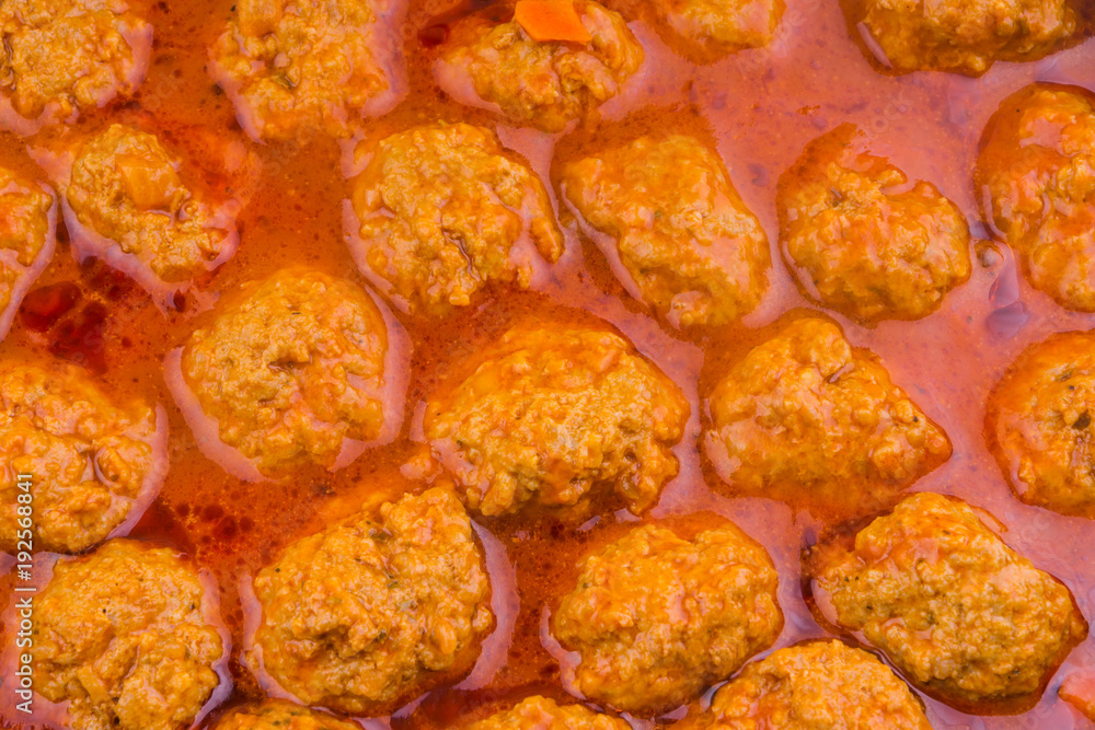Meatballs cooked in a tomato sauce closeup Meatballs cooked in a tomato sauce closeup