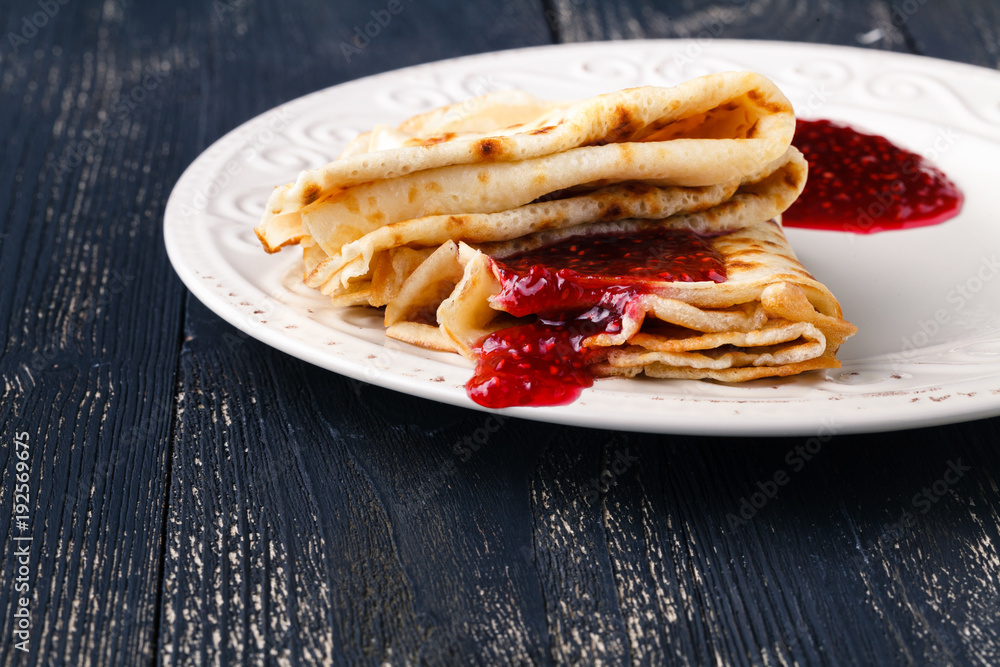 shrovetide concept, pancake with  sweet berry  jam