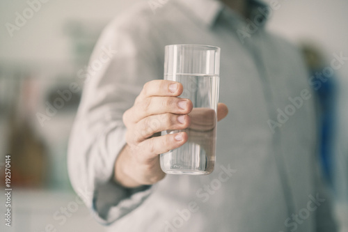 Male holding glass of water