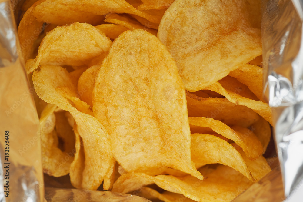 Potato chips in a silver package. Close-up.