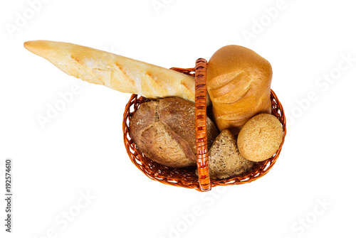 Various bread rolls in a basket isolateda white background. top view photo