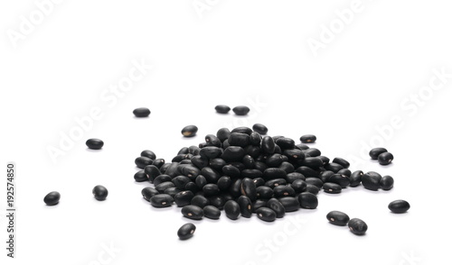 Pile organic black beans, isolated on white background