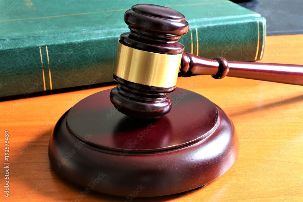 An concept Image of a judge hammer with a book An concept Image of a judge hammer with a book