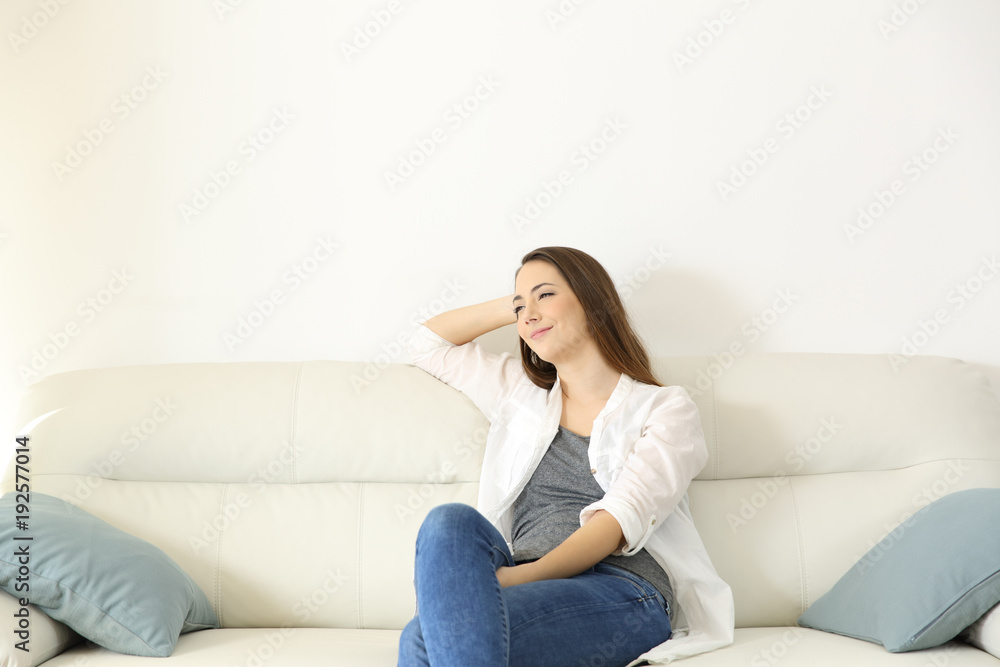 Woman resting in a couch with copy space above Woman resting in a couch with copy space above