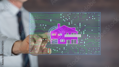 Man touching a digital smart home automation concept on a touch screen