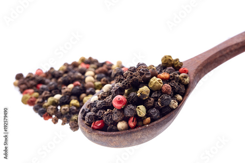 Top view of a wooden spoon full of allspice seeds isolated on white background, shallow depth of field, front focus