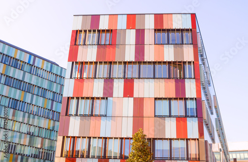 MILAN, ITALY - October 13, 2017: Modern exterior of a colorful office building in Milan, Italy, Colorful building background.