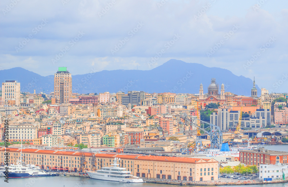 High angle view of Genoa (Genova) city with sea view, port, harbor and yachts in natural background.