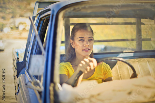 Beautiful girl driving a truck