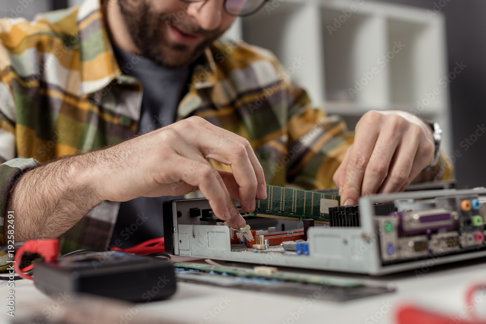 caucasian man reapairing repairing computer caucasian man reapairing repairing computer