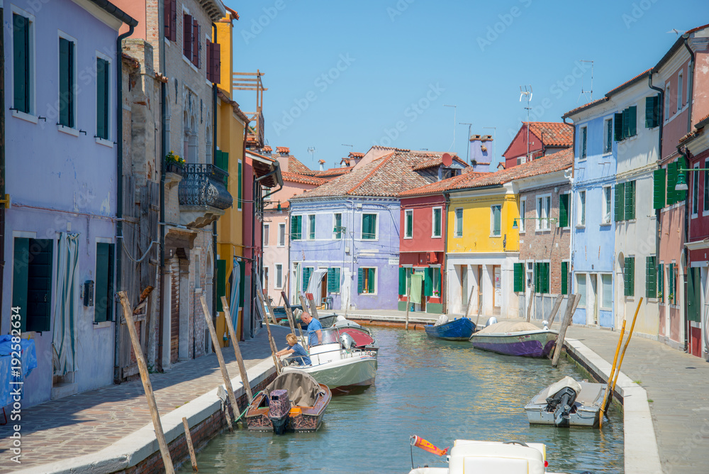 Canal in Burano, near Venice, in a sunny day