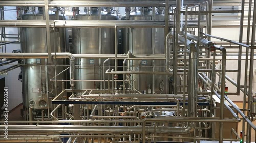 Wallpaper Mural Pipeline in a modern dairy factory. Pipeline of the plant. Huge tanks for storing and fermenting milk. Pipeline in modern dairy factory. Modern factory interior. Torontodigital.ca