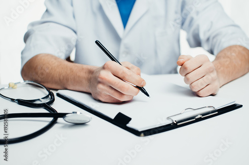 The doctor says, big hands, next to the stethoscope in the hospital on a white background