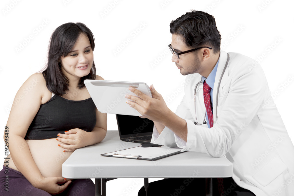 Pregnant woman having a consultation with a gynecologist Pregnant woman having a consultation with a gynecologist