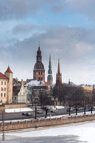 Riga city across Daugava river in winter time, Latvia.