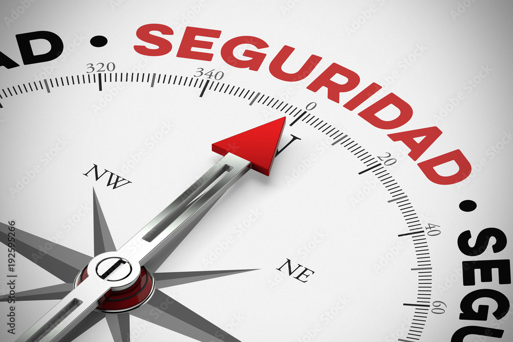 Kompass zeigt auf Seguridad / Sicherheit als Konzept Kompass zeigt auf Seguridad / Sicherheit als Konzept